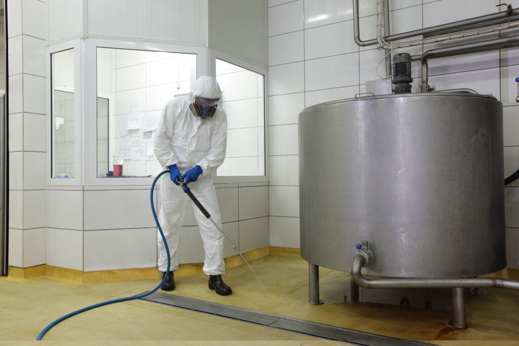 industrial cleaning personnel cleaning facility drain