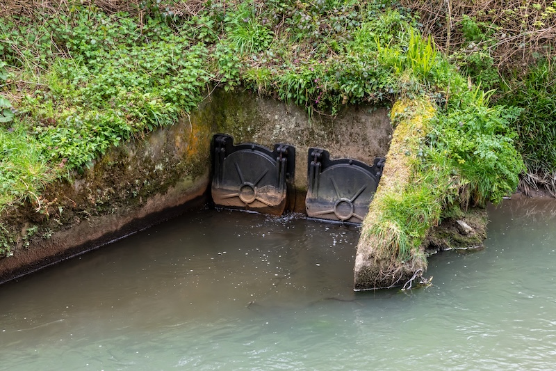 Storm drain outflow into river